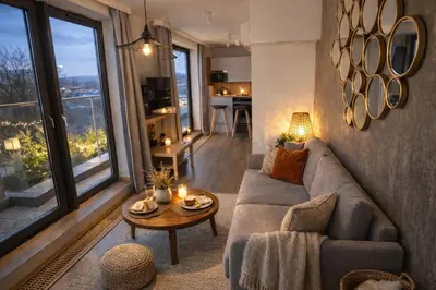 a dining room with a table and chairs at Apartamenty nad Wisłą in Kraków