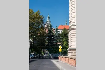 a view of a street with a building and trees at Przy Wawelu z Garażem w cenie in Kraków