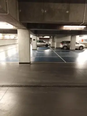 a parking lot with cars parked in a parking garage at Przy Wawelu z Garażem w cenie in Kraków