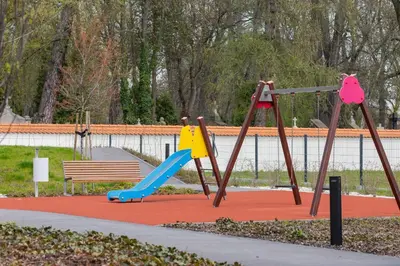 a playground with a slide and a swing set at Apartments Steam Park Old Town Cracow by Noclegi Renters in Kraków