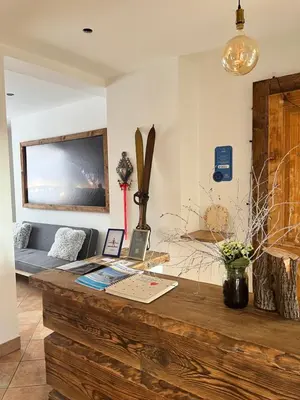 a kitchen with green cabinets and a table and a microwave at U Kapiarza in Klikuszowa