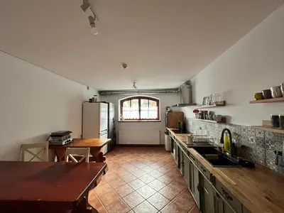 a kitchen with a counter top and a refrigerator at U Kapiarza in Klikuszowa