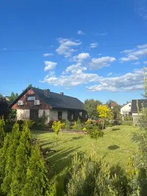 a view of a house from the garden at Malinowa Chatka in Jankowice