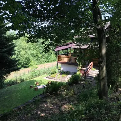 a park with a gazebo in the middle of a yard at Rudera u Sióstr DREWNIANY DOMEK Stróża in Stróża