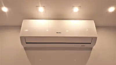 a kitchen with two lights on top of a appliance at MOGILSKA Apartments near Tauron Arena Krakow in Kraków