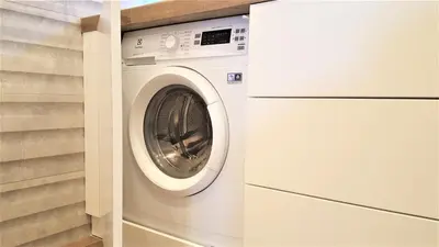 a washer and dryer in a laundry room at MOGILSKA Apartments near Tauron Arena Krakow in Kraków