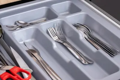 a white tray with silver utensils and a pair of scissors at Apartment Joselewicza Cracow Kazimierz by Noclegi Renters in Kraków