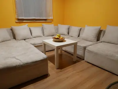 a living room with a couch and a table at 22 Kąty in Radziemice