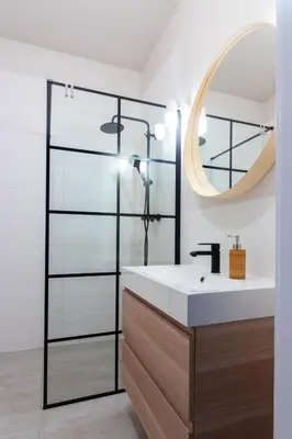 a bathroom with a sink and a mirror at Apartments nearto Main Railway Station in Kraków