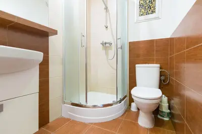 a bathroom with a sink and a shower at The quiet blue home in the city center! in Kraków