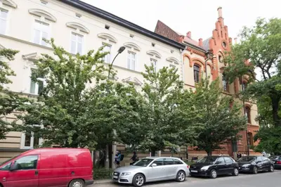 a group of cars parked in front of a building at The quiet blue home in the city center! in Kraków