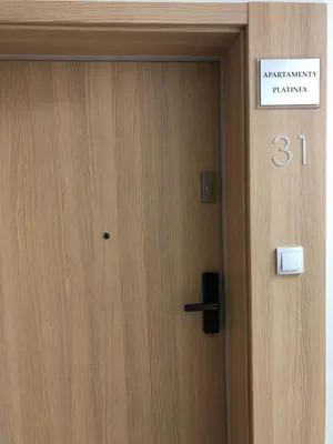 a door with a sign that reads embassy training at Apartamenty Platinex 3 in Kraków