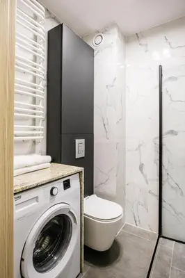 a bathroom with a sink and a shower at Apartamenty Platinex 3 in Kraków