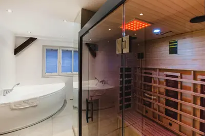 a bathroom with a tub and a sink and a shower at be HAPPY Apartments & Breakfast in Kraków