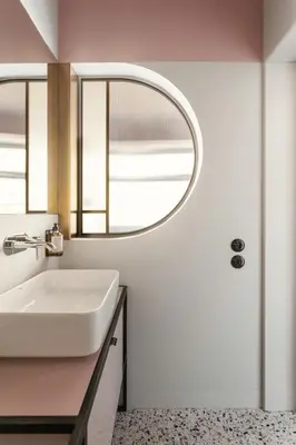 a bathroom with a sink and a mirror at Angelus Apartments in Kraków