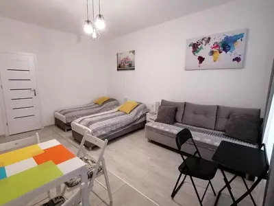 a living room with a couch and a table at Gladiator Noclegi Zator II in Zator