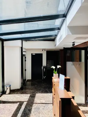 a lobby of a building with a glass ceiling at Beautiful studio for couples with Air Conditioning - Old Town & Main station in Kraków