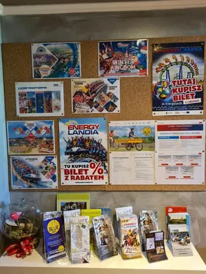 a counter with posters on the wall of a store at Apartament DeLuxe 2 in Oświęcim
