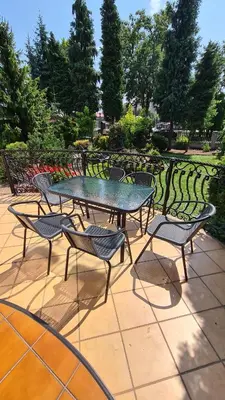 a table and chairs sitting on a patio at Apartament DeLuxe 2 in Oświęcim