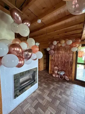 a living room with balloons and a fireplace at Ranczo Targoszów in Targoszów