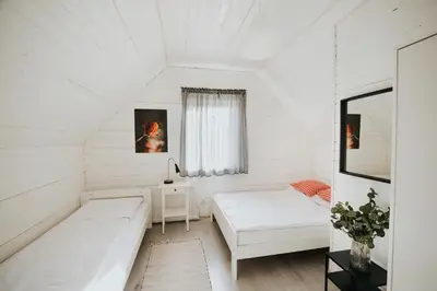 a white room with a couch and a table at Domki Beskidowelove Gierałtowiczki A in Zator