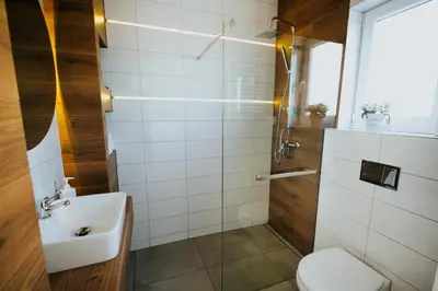 a bathroom with a toilet and a sink at Domki Beskidowelove Gierałtowiczki A in Zator