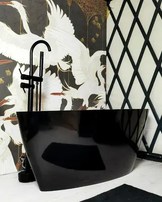 a black umbrella with white birds on a wall at LushHills - Stylowa i Naturalna Jurta in Regulice