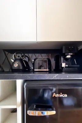 a close up of a stove top in a microwave at LushHills - Stylowa i Naturalna Jurta in Regulice