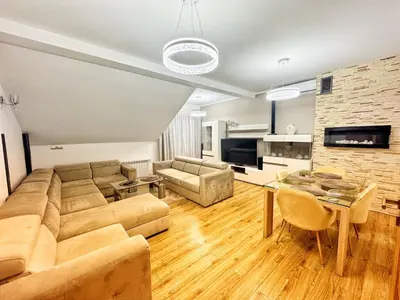 a living room with a couch and a table at Apartament Premium Skawina in Skawina