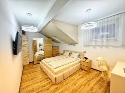 a bedroom with a bed and a tv in it at Apartament Premium Skawina in Skawina