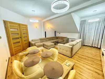 a living room with a table and a couch at Apartament Premium Skawina in Skawina