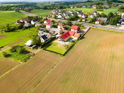 an aerial view of a farm with a field and houses at Ojcowski Las in Biały Kościół