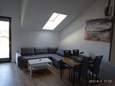 a living room with a couch and a table at Apartamenty Kasztanowa Zator in Zator