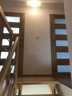 a room with a staircase and a door at Domek Damianki - cały dom in Zawoja