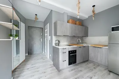 a kitchen with a sink and a refrigerator at Barska 69 Taras 360 in Kraków