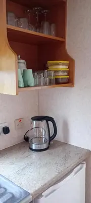 a tea pot sitting on a counter in a kitchen at Gosp. Agroturystyczne Stary Gaj in Żerkowice