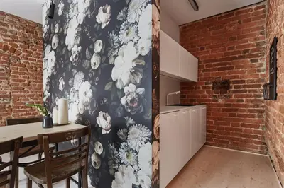 a kitchen and dining room with a brick wall at OLD NEW - Prime Location on Main Square in Kraków