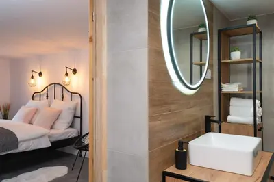 a bathroom with a sink and a mirror at Staymoovers - Secret Loft w pobliżu Krakowa in Paszkówka