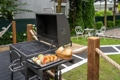 a grill with a basket of vegetables on it at Staymoovers - Secret Loft w pobliżu Krakowa in Paszkówka
