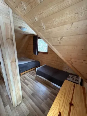 a room with bunk beds in a tiny house at Gorczańska Ostoja in Klikuszowa
