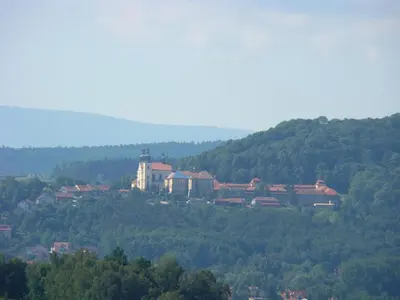 a town on top of a hill with trees at Dom Pielgrzyma in Kalwaria Zebrzydowska