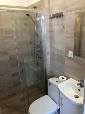 a bathroom with a shower and a toilet and a sink at Noclegi Bachowice - Zator Energylandia Wadowice in Bachowice