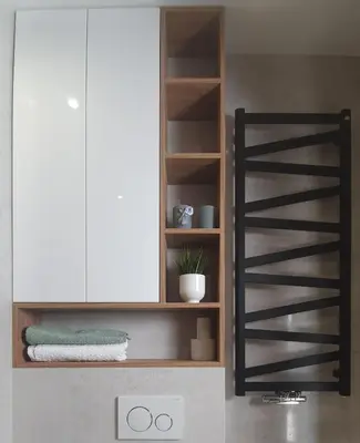 a kitchen with a shelf and a white cabinet at Apartament Green Diamond Rakowicka in Kraków
