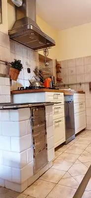 an oven with a fire inside of it at ZALASEK Gospodarstwo Agroturystyczne z Alpakami in Dobra