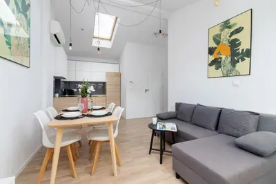 a desk with a chair and a mirror at Apartments Dietla Cracow by Noclegi Renters in Kraków