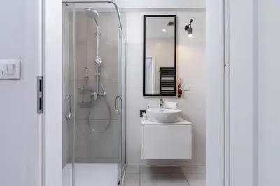 a bathroom with a shower and a sink at Apartments Dietla Cracow by Noclegi Renters in Kraków