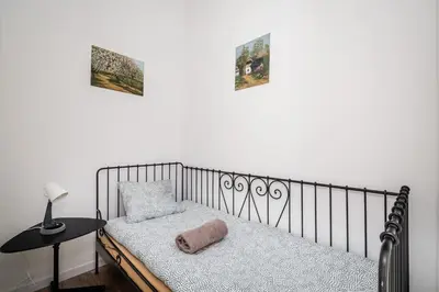 a bedroom with a bed with a pillow on it at LoL in Kraków