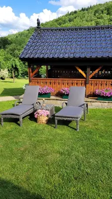 two chairs and a gazebo in a park at Sękata Chata Zawoja in Zawoja