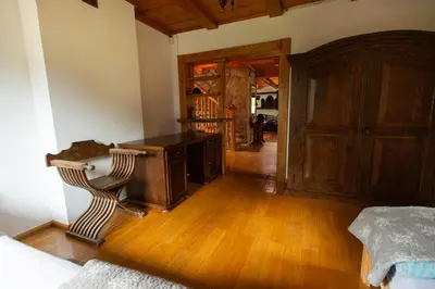 a room with a desk and a wooden floor at Zbójnicka Chata in Wieliczka