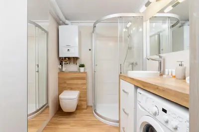 a bathroom with a shower and a toilet and a sink at Duplex Apartment Brandy Cracow by Noclegi Renters in Kraków